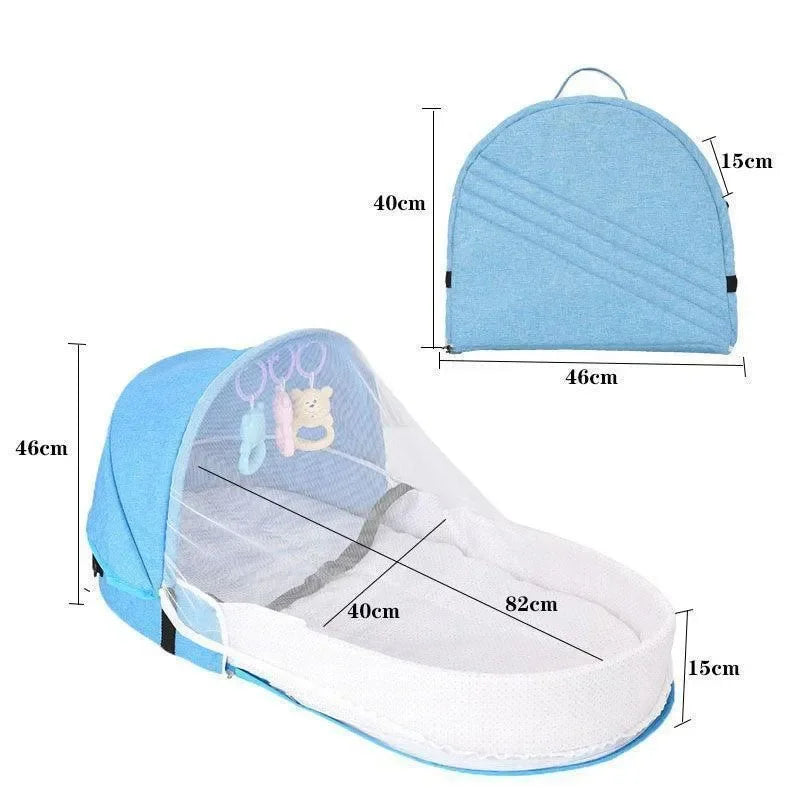 Lit de voyage bébé bleu pliable avec moustiquaire et jouets suspendus, dimensions indiquées