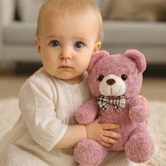 Ours en peluche vieux rose avec nœud paipillon