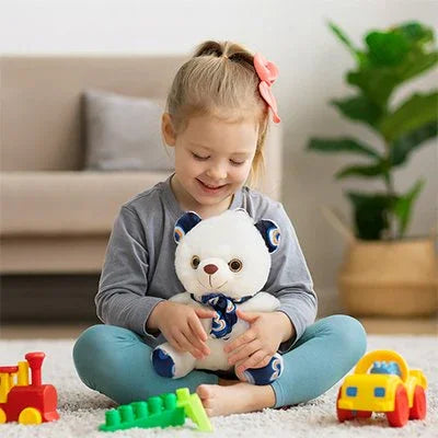 Ours en peluche bleu avec petite fille