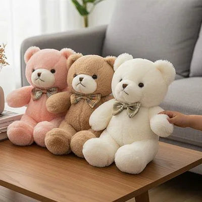 Ours en peluche de couleur rose beige et blanc