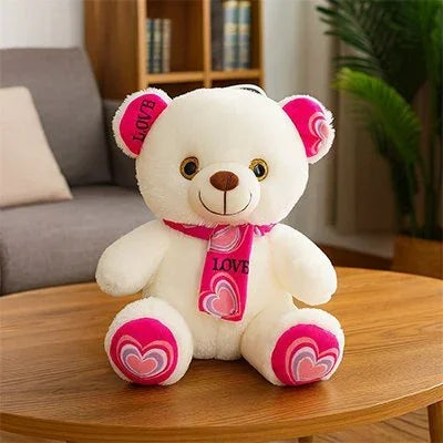 Ours en peluche rose sur une tables