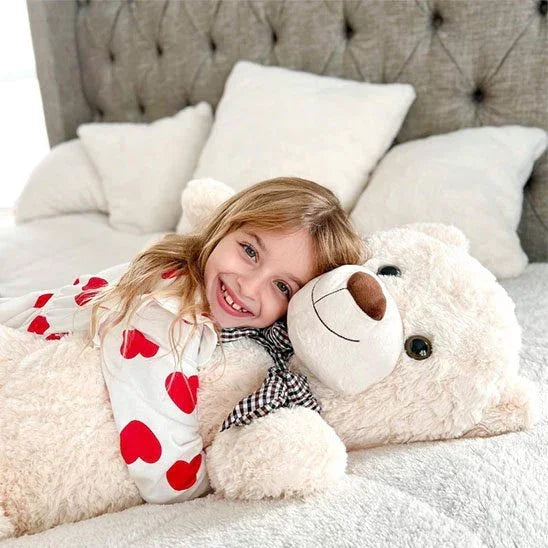 Ours en peluche  xxl avec petite fille en pyjama