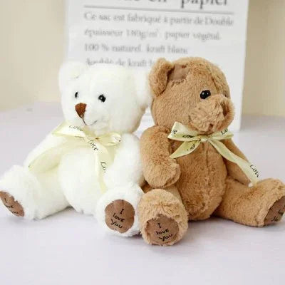Ours peluche blanc et ours en peluche brun
