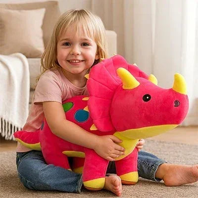 Peluche dinosaure rose avec petite fille
