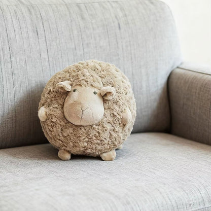 peluche-mouton-beige-rond-sur-canape