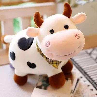 Peluche vache posée sur un meuble