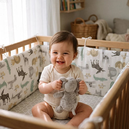 Tour de lit bébé avec bébé assis protegé